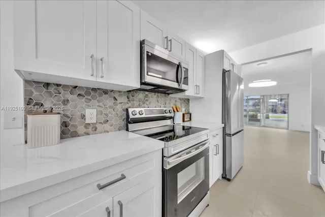 a view of storage and utility room with washer and dryer