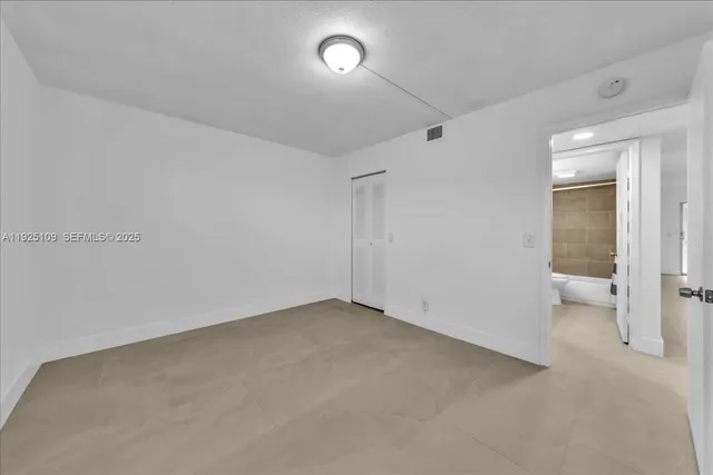 a view of a livingroom with furniture and a window