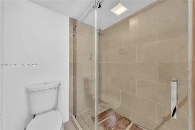 a city street lined with buildings and trees