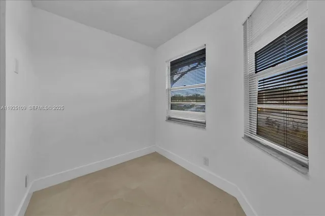 a kitchen with stainless steel appliances granite countertop lots of counter top space and cabinets