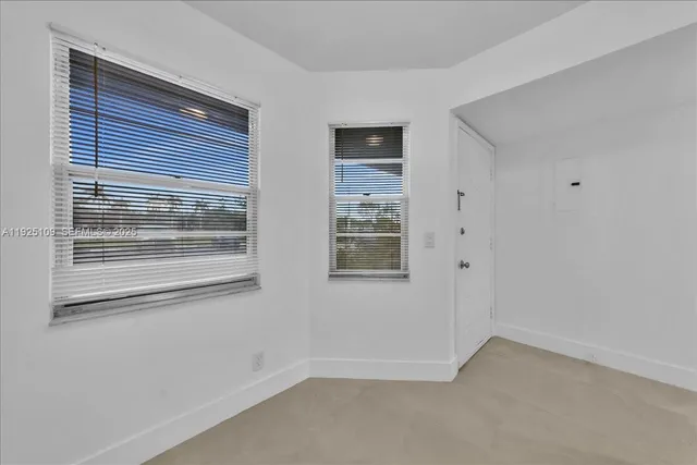 a kitchen with granite countertop a stove and a sink