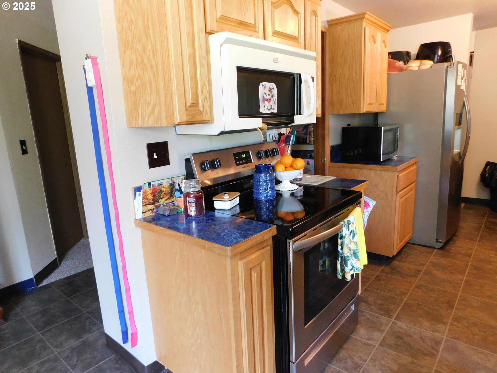 231 Northeast Darrell Avenue Winston, OR 97496 - Photo 15 of 47 a kitchen with stainless steel appliances granite countertop a stove and a refrigerator