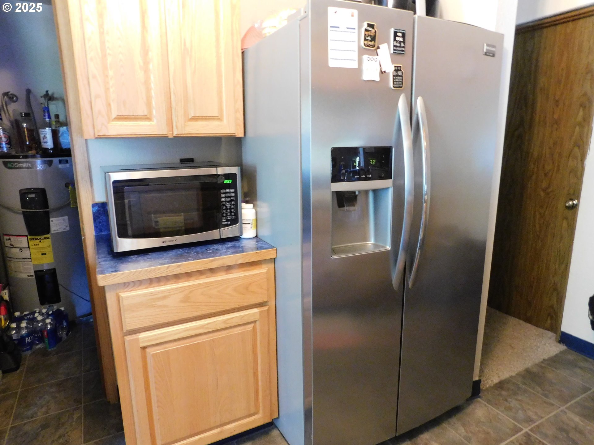 231 Northeast Darrell Avenue Winston, OR 97496 - Photo 17 of 47 a kitchen with metallic refrigerator freezer and a dishwasher