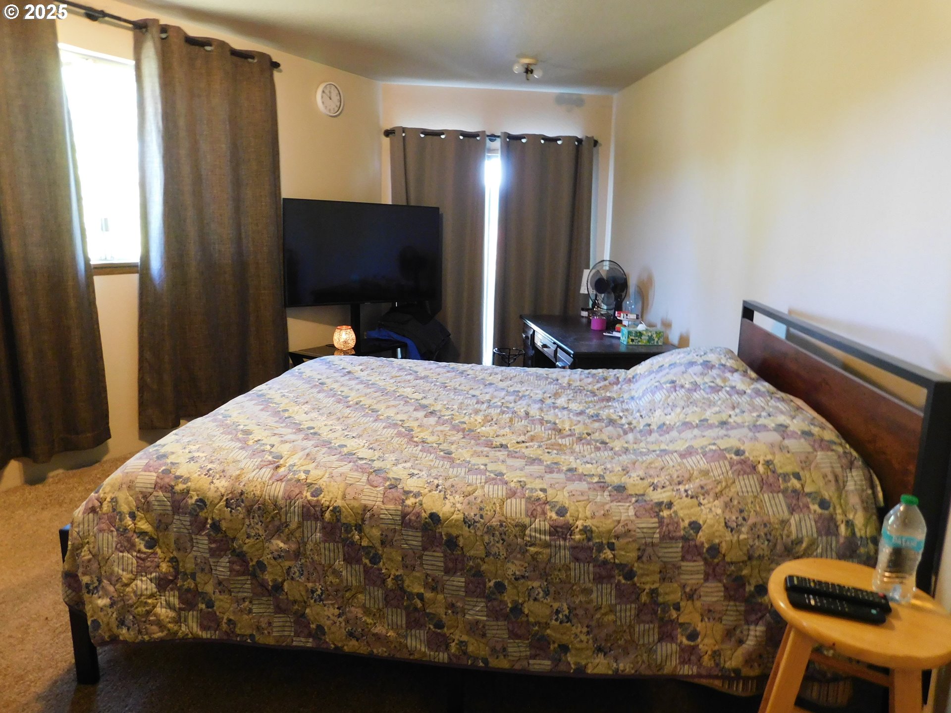 231 Northeast Darrell Avenue Winston, OR 97496 - Photo 21 of 47 a bedroom with a bed and a flat screen tv