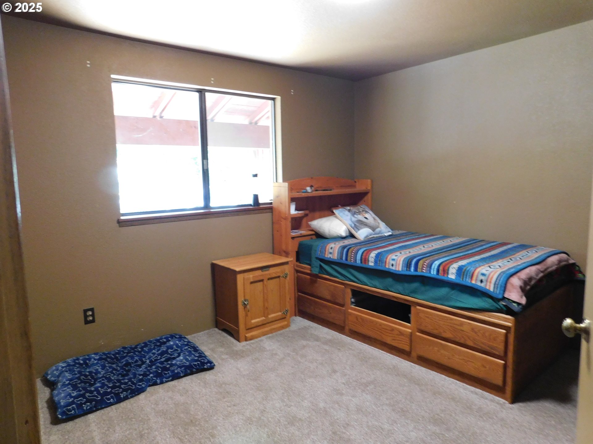 231 Northeast Darrell Avenue Winston, OR 97496 - Photo 27 of 47 a bed room with a bed and a window
