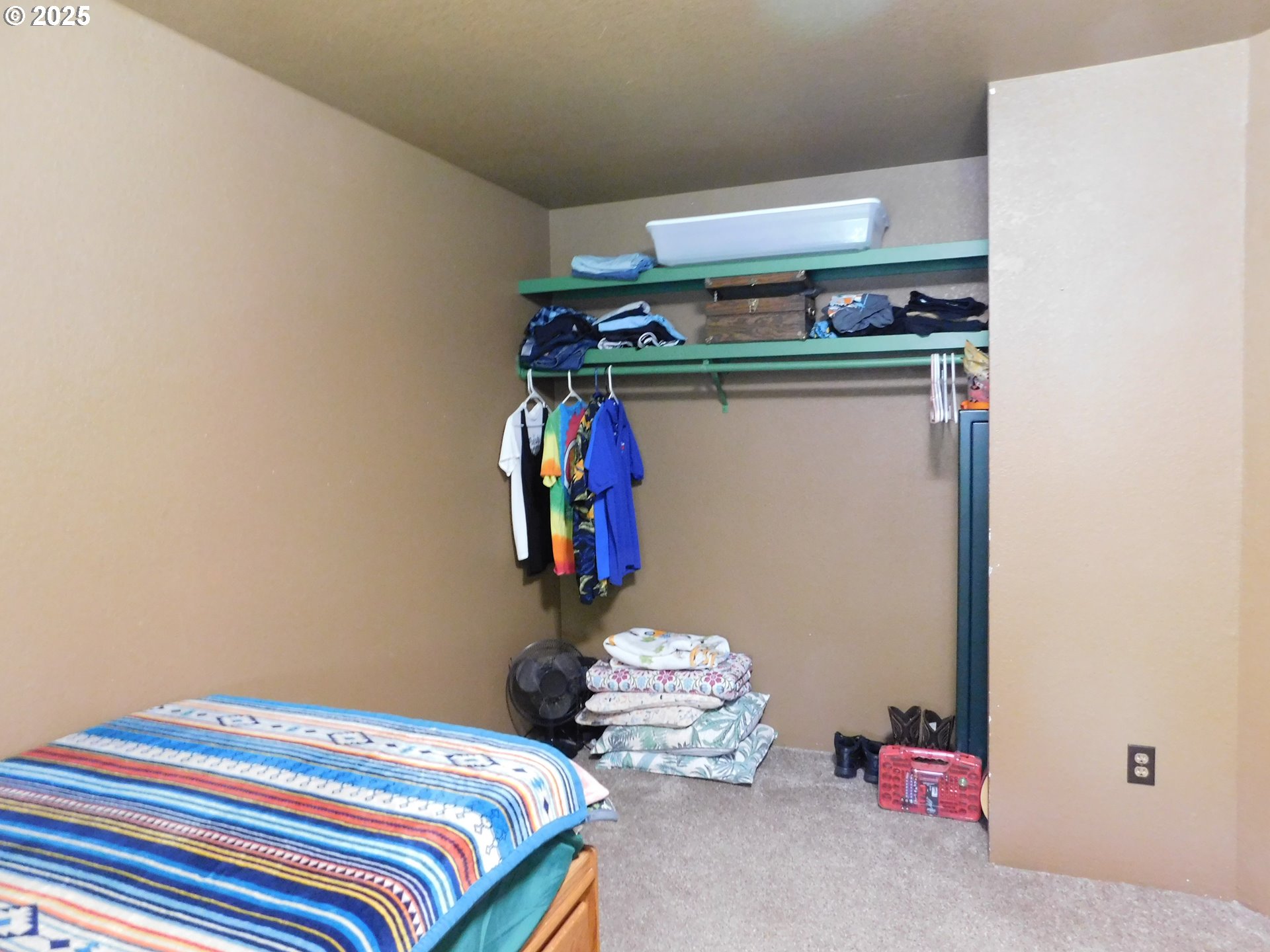 231 Northeast Darrell Avenue Winston, OR 97496 - Photo 30 of 47 a bedroom with a bed and storage