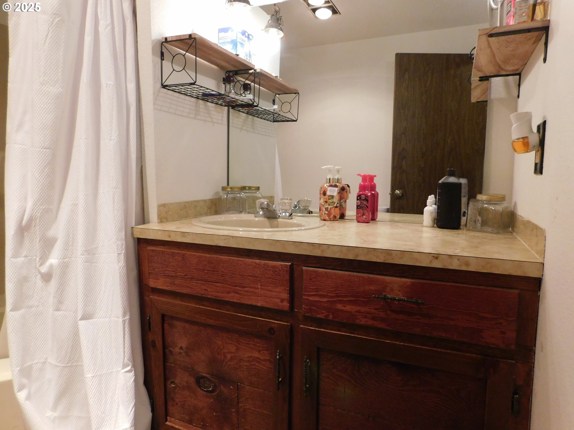231 Northeast Darrell Avenue Winston, OR 97496 - Photo 31 of 47 a bathroom with a sink and a mirror