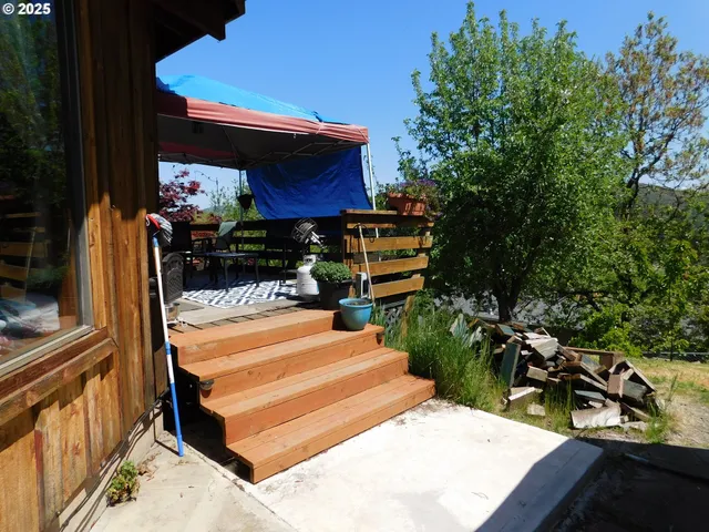 a view of a two chairs in the balcony