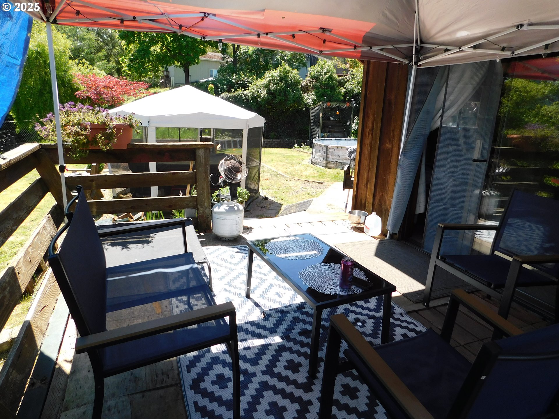 231 Northeast Darrell Avenue Winston, OR 97496 - Photo 40 of 47 a view of a patio with table and chairs under an umbrella