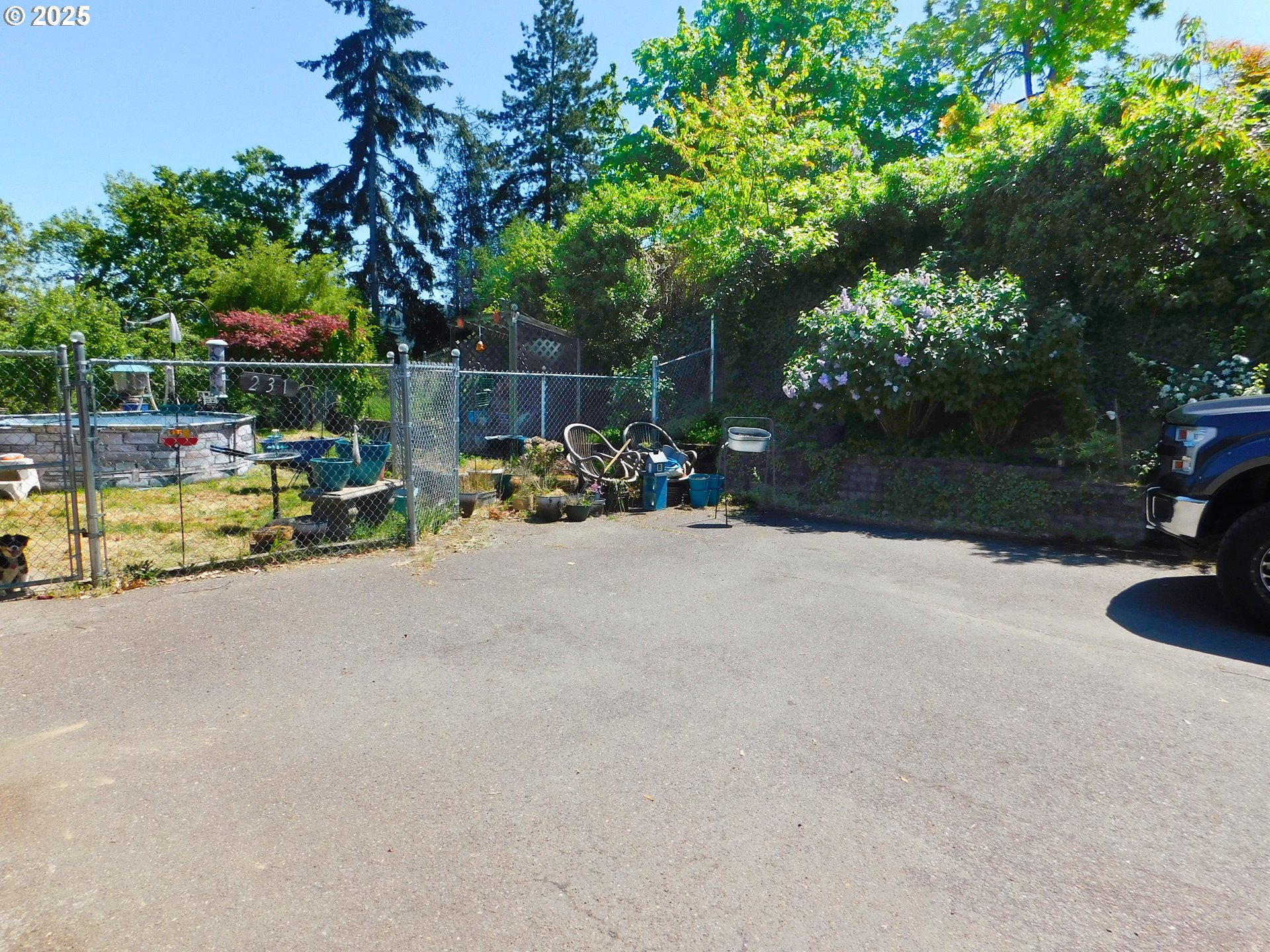 231 Northeast Darrell Avenue Winston, OR 97496 - Photo 47 of 47 a view of a backyard with a bench and some trees