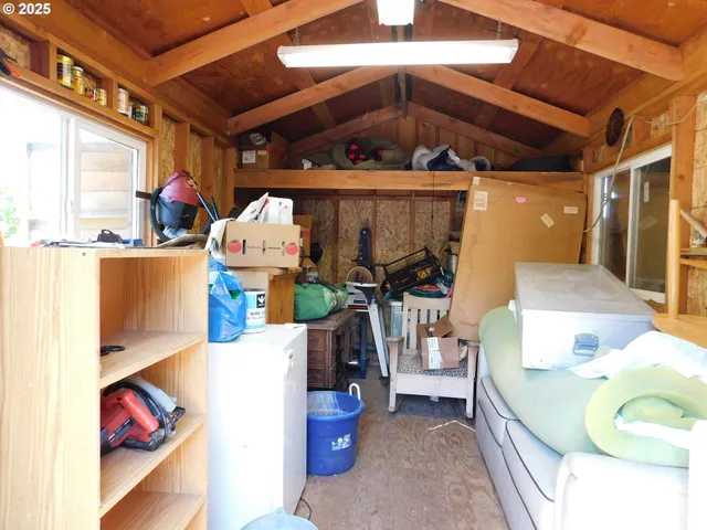 a bedroom with bed and a chandelier