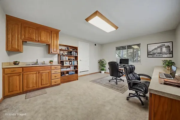 a kitchen with granite countertop a stove a sink and a cabinets