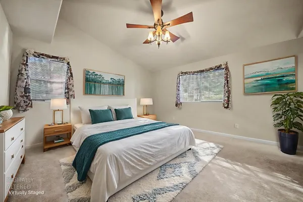 a view of a wooden house and a yard