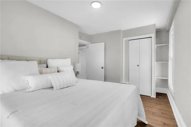 a bedroom with a bed and a rug