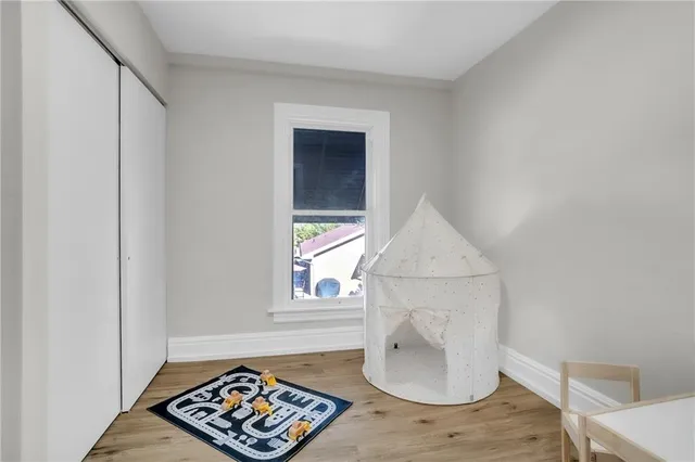 a picture of wooden floor with a table and chair