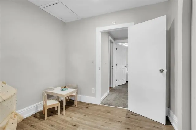 a view of a room that has a table and chairs in it