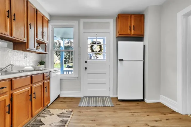a kitchen with a refrigerator and cabinets