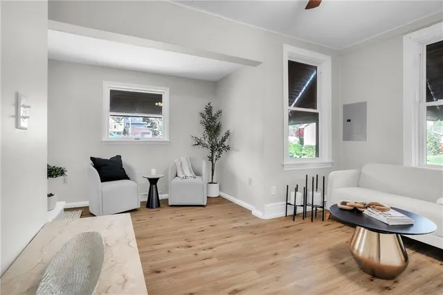 a living room with furniture and a window
