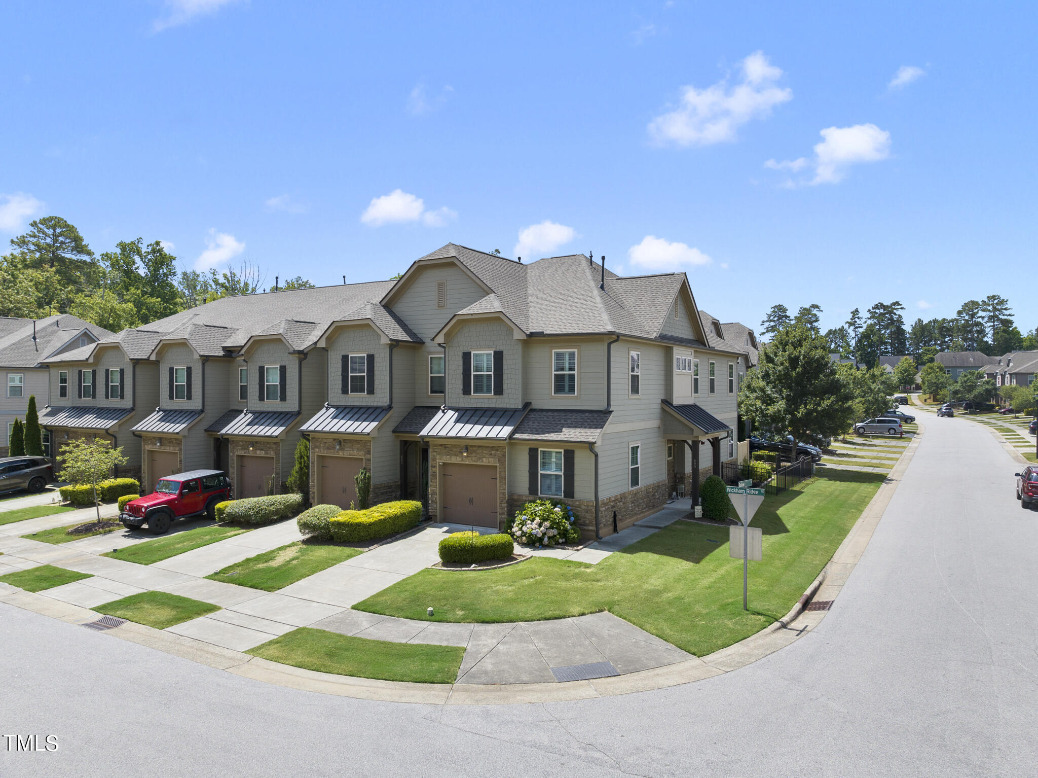 699 Wickham Ridge Road Apex, NC 27539 - Photo 1 of 36 a front view of a house with a yard and porch