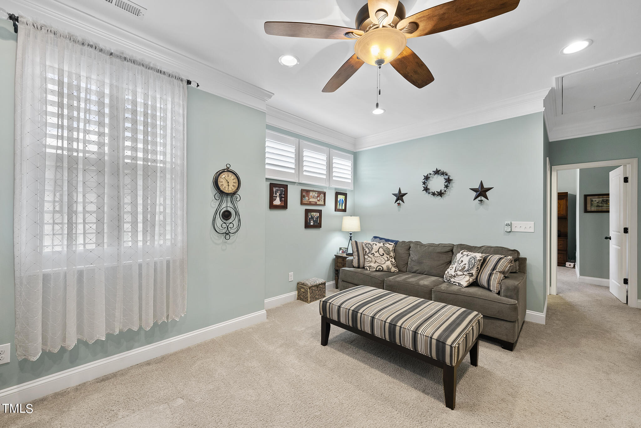 699 Wickham Ridge Road Apex, NC 27539 - Photo 20 of 36 a living room with furniture and a large window