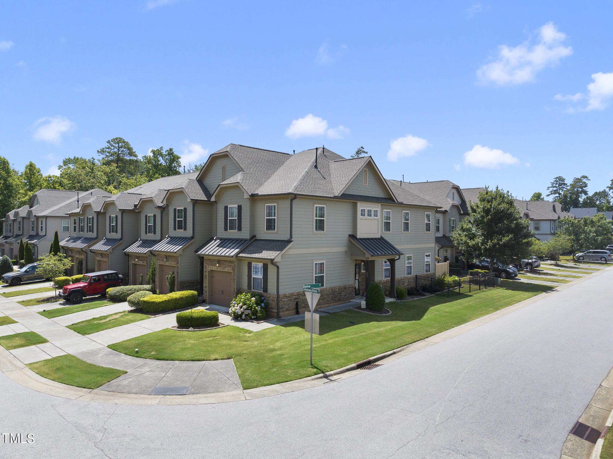 699 Wickham Ridge Road Apex, NC 27539 - Photo 2 of 36 a front view of a house with a yard and porch