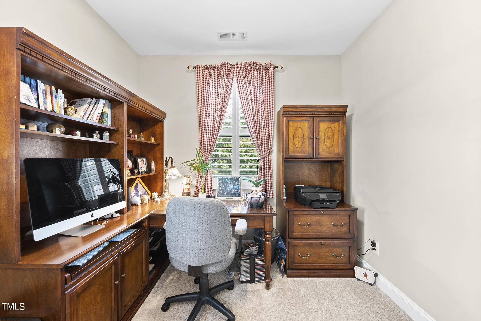 699 Wickham Ridge Road Apex, NC 27539 - Photo 29 of 36 a view of a workspace with furniture and a window