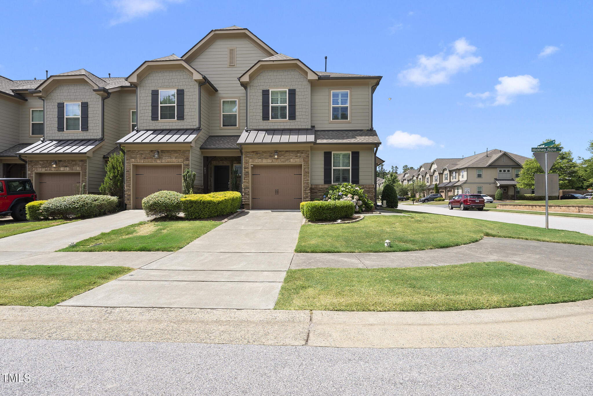 699 Wickham Ridge Road Apex, NC 27539 - Photo 36 of 36 a front view of a house with a yard