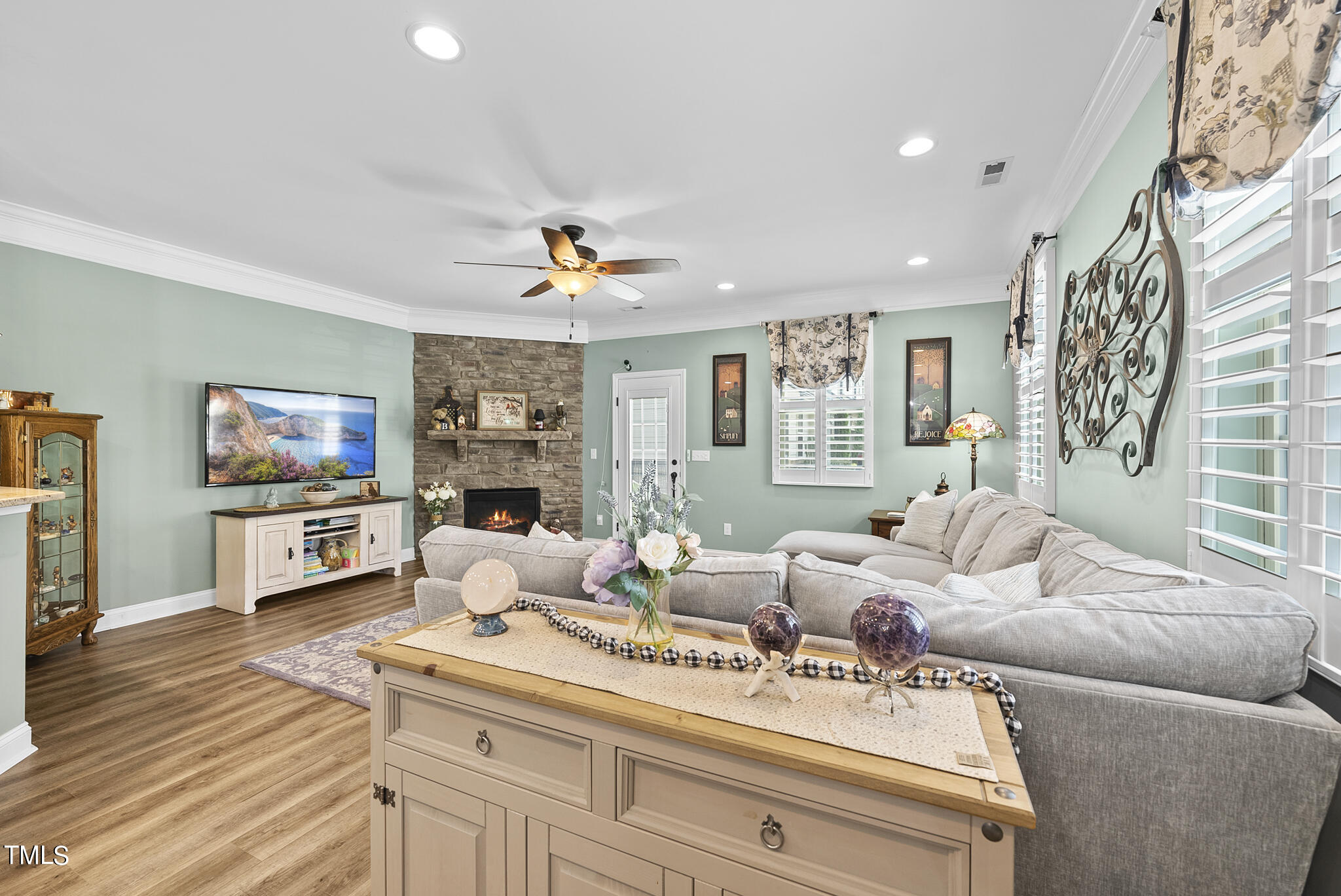 699 Wickham Ridge Road Apex, NC 27539 - Photo 6 of 36 a living room with furniture and a flat screen tv