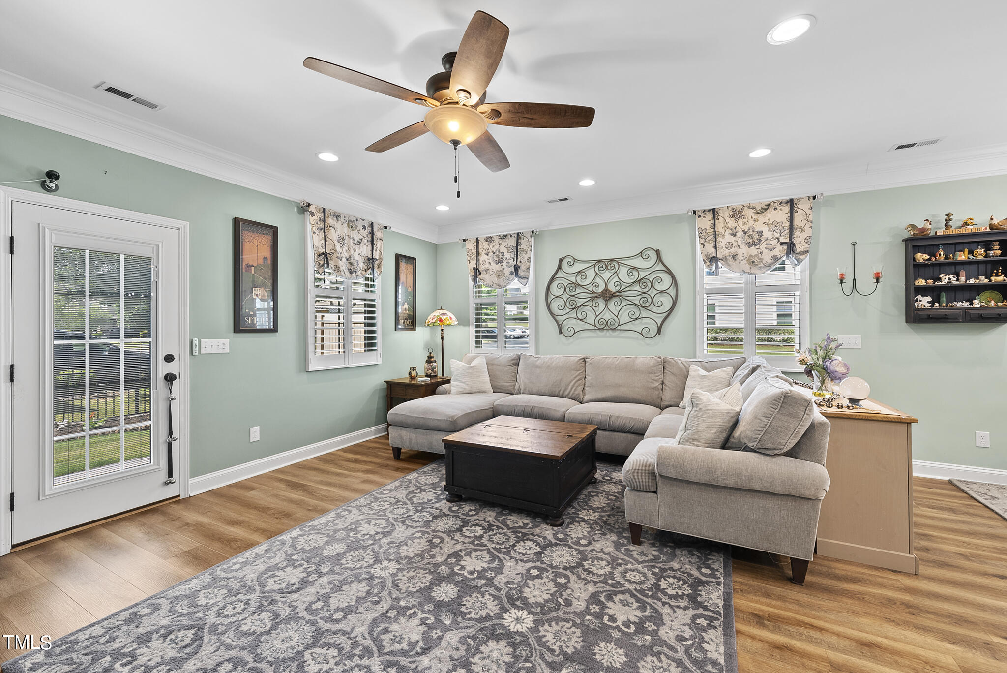 699 Wickham Ridge Road Apex, NC 27539 - Photo 7 of 36 a living room with furniture and a large window