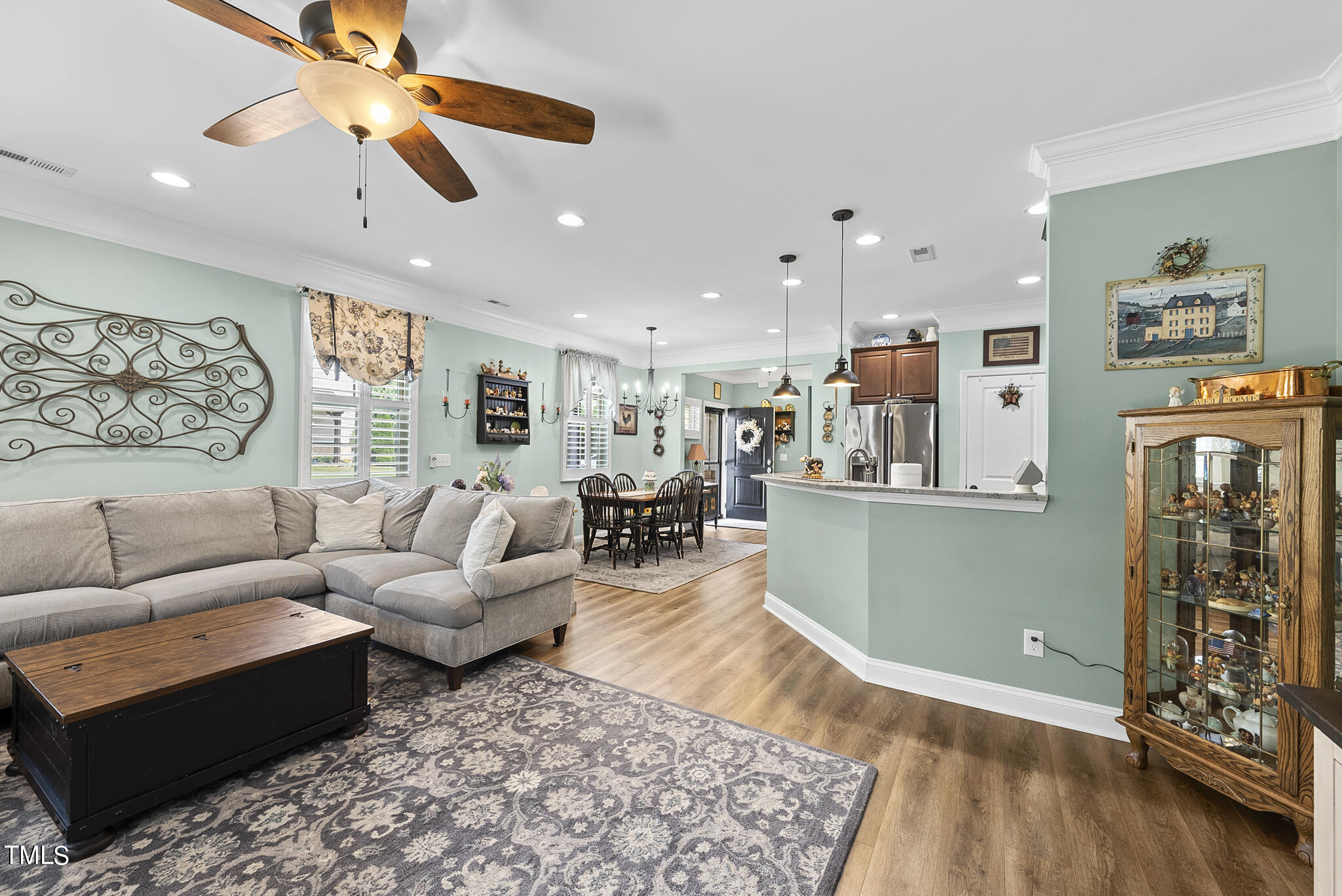 699 Wickham Ridge Road Apex, NC 27539 - Photo 9 of 36 a living room with furniture and wooden floor