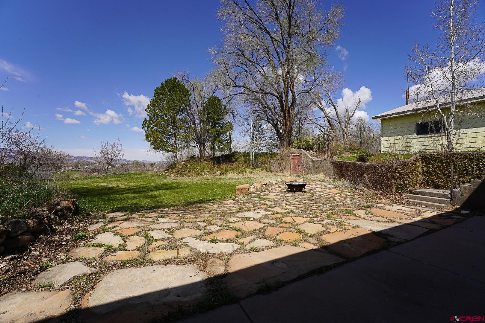 2326 I Road Grand Junction, CO 81505 - Photo 13 of 33 a view of a wooden house with a yard