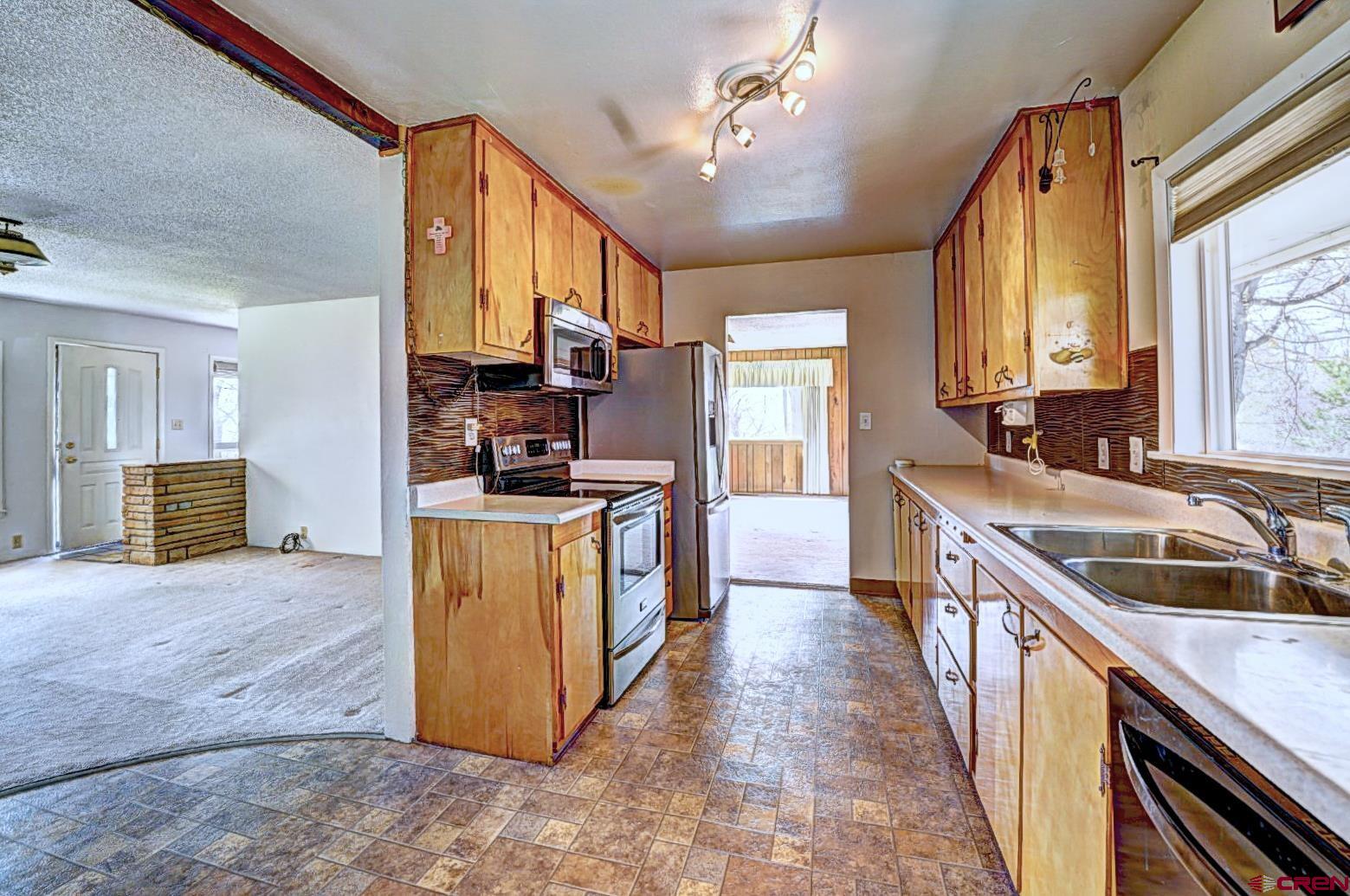 2326 I Road Grand Junction, CO 81505 - Photo 26 of 33 a kitchen with sink cabinets and counter