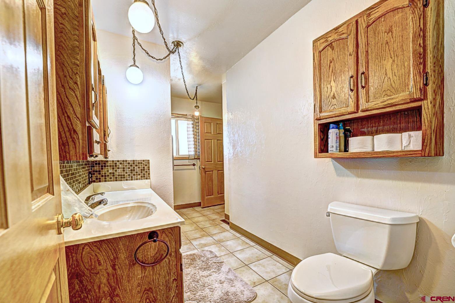 2326 I Road Grand Junction, CO 81505 - Photo 27 of 33 a bathroom with a sink a toilet and shower