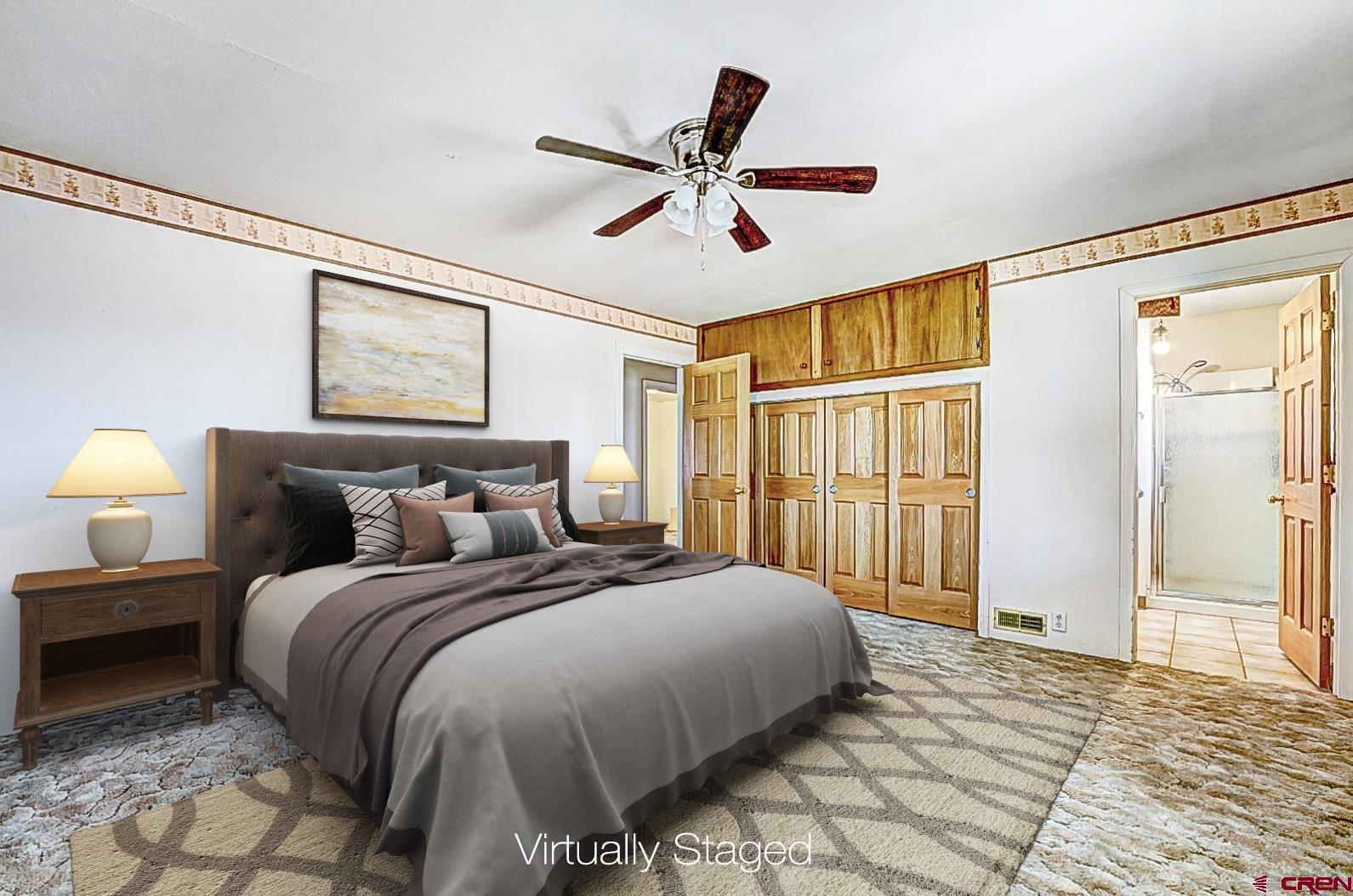 2326 I Road Grand Junction, CO 81505 - Photo 8 of 33 a bedroom with a bed and a large window