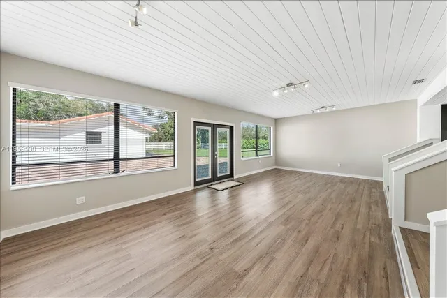 a bathroom with a glass shower door and a bathtub