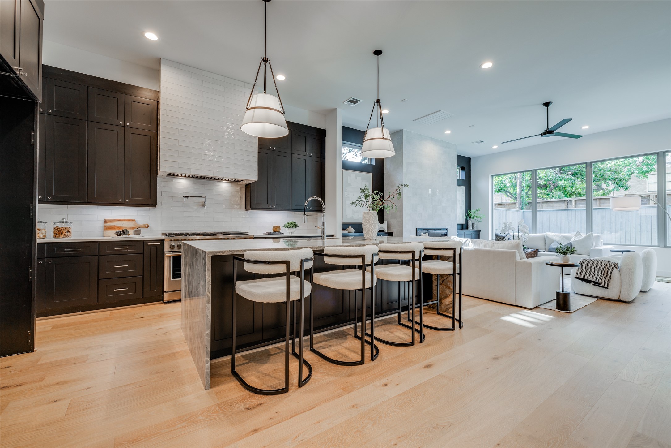 1824 Marshall Street Houston, TX 77098 - Photo 13 of 45 a kitchen with stainless steel appliances kitchen island a table and chairs in it