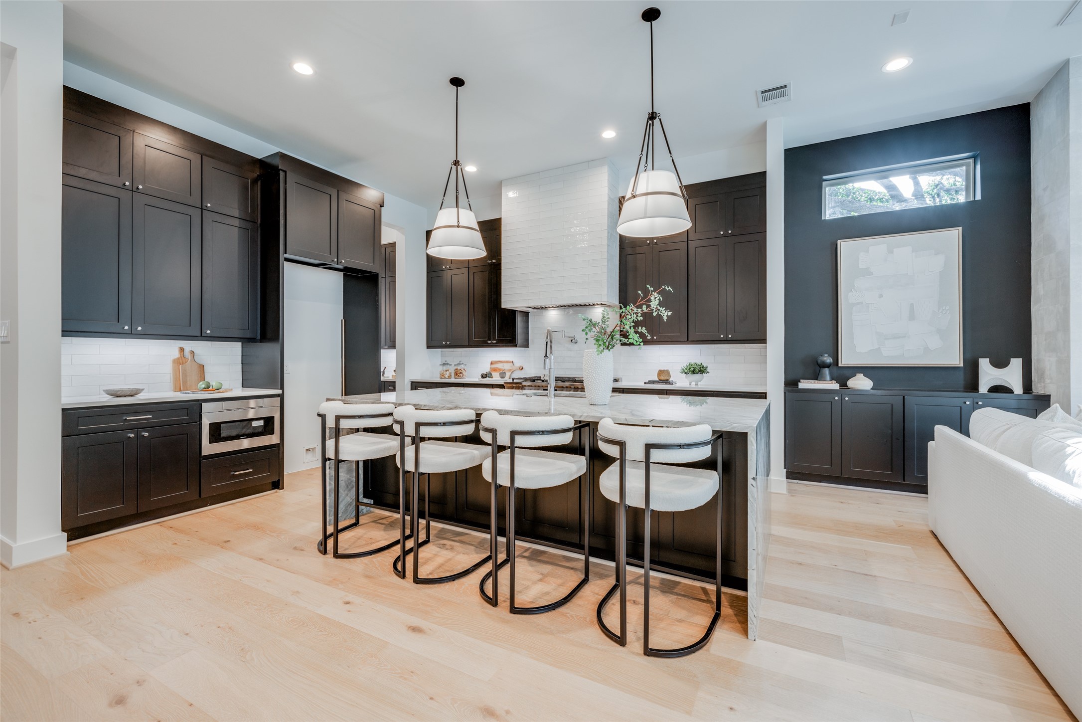 1824 Marshall Street Houston, TX 77098 - Photo 16 of 45 a kitchen with a dining table chairs sink and cabinets