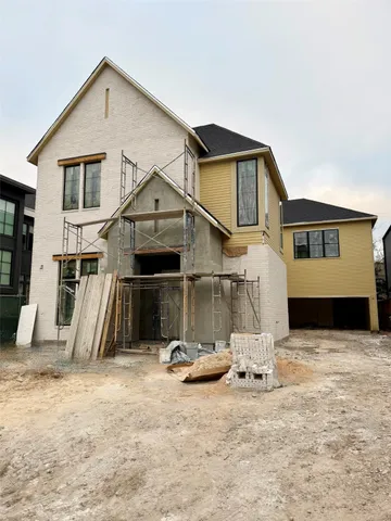 a front view of a house with large windows
