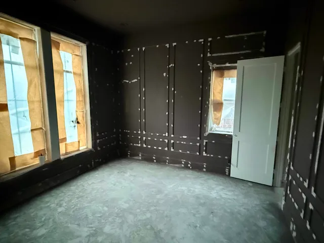 a large white room with a large window