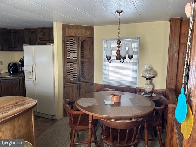 9916 Golf Course Road, Unit 61 Ocean City, MD 21842 - Photo 15 of 18 a dining table with chairs and table