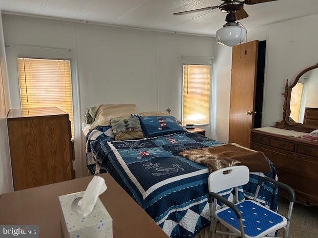 9916 Golf Course Road, Unit 61 Ocean City, MD 21842 - Photo 16 of 18 a bed room with a bed and a dresser