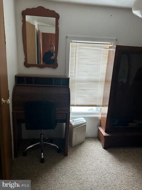 9916 Golf Course Road, Unit 61 Ocean City, MD 21842 - Photo 17 of 18 a living room with a couch and a fireplace