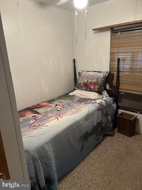 9916 Golf Course Road, Unit 61 Ocean City, MD 21842 - Photo 18 of 18 a bedroom with a bed and a mirror