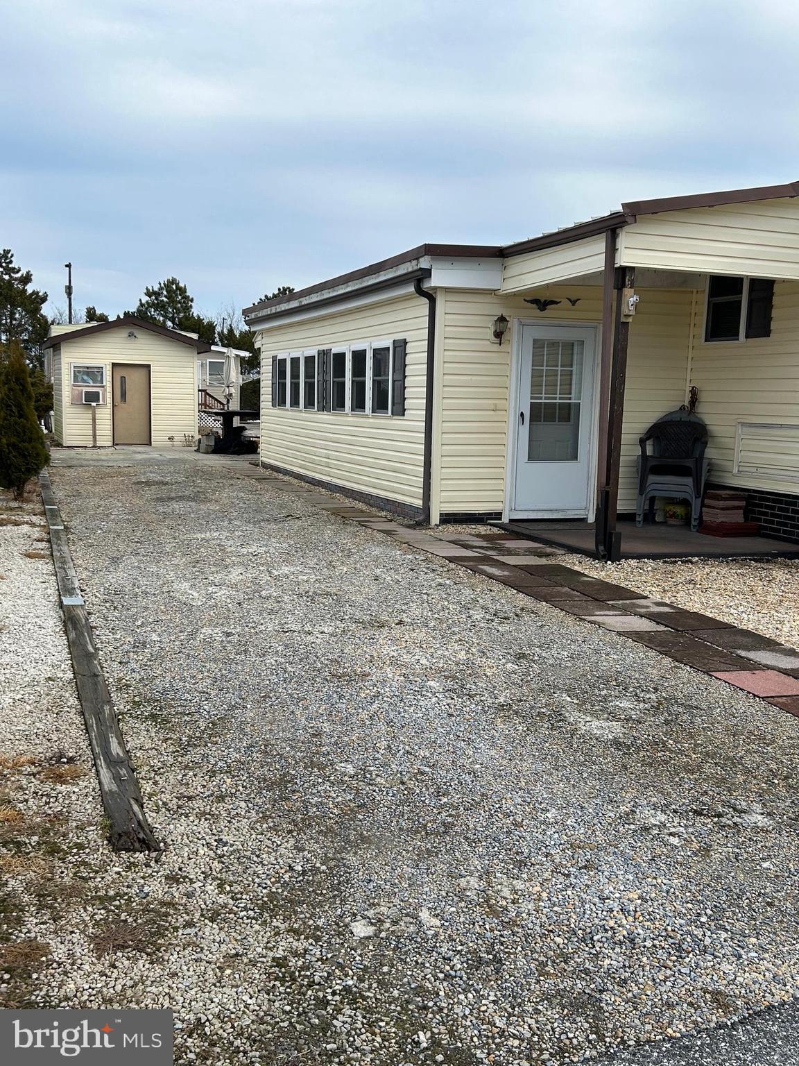 9916 Golf Course Road, Unit 61 Ocean City, MD 21842 - Photo 2 of 18 a view of a house with a backyard