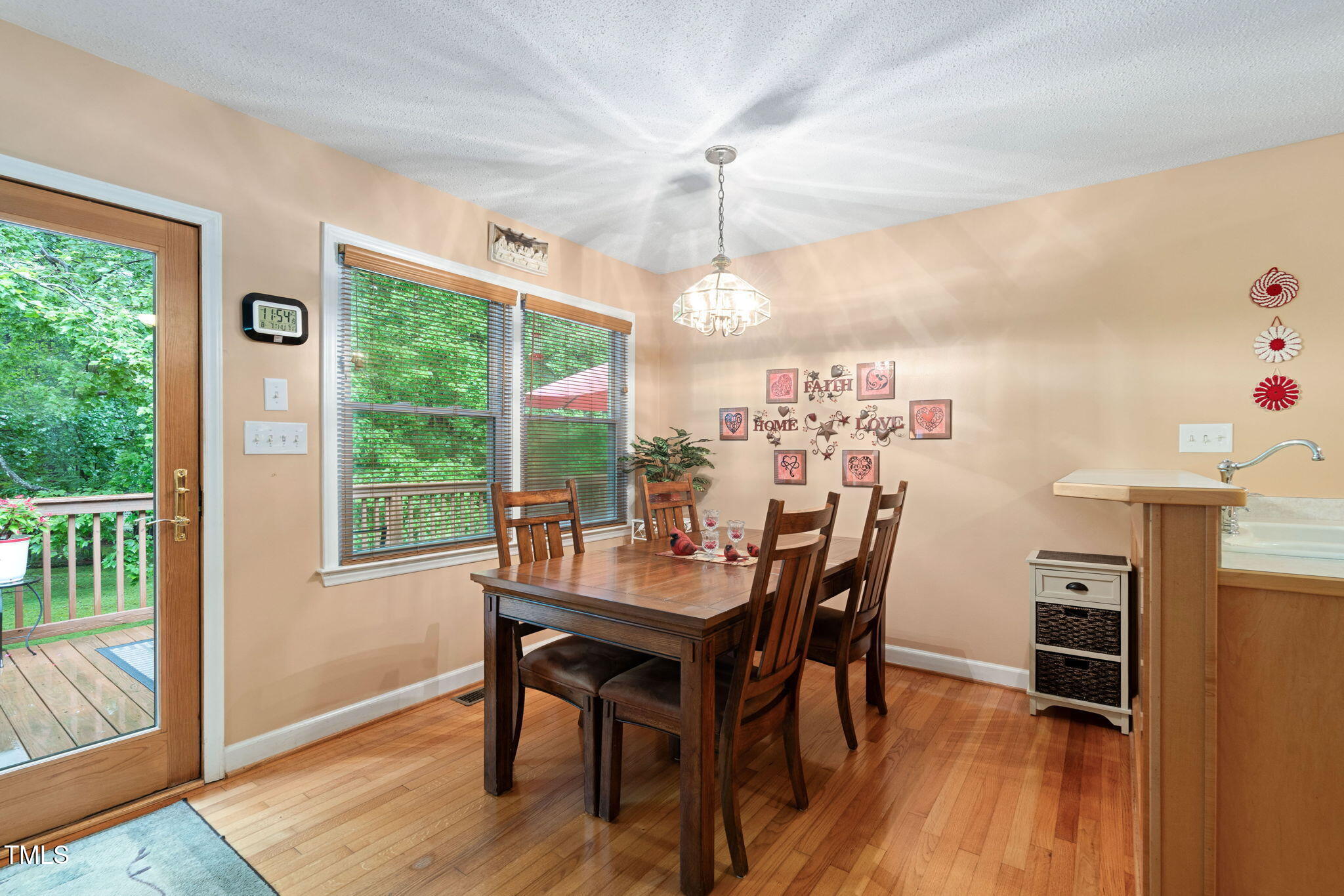 8236 Jackson Road Wake Forest, NC 27587 - Photo 18 of 74 a view of a dining room with furniture window and wooden floor