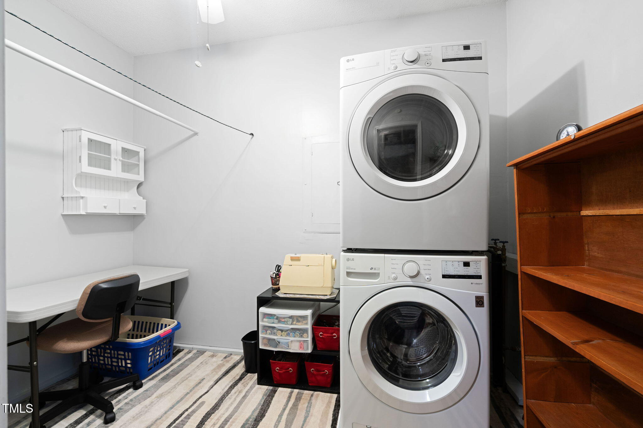8236 Jackson Road Wake Forest, NC 27587 - Photo 24 of 74 a utility room with dryer washer and a view of kitchen