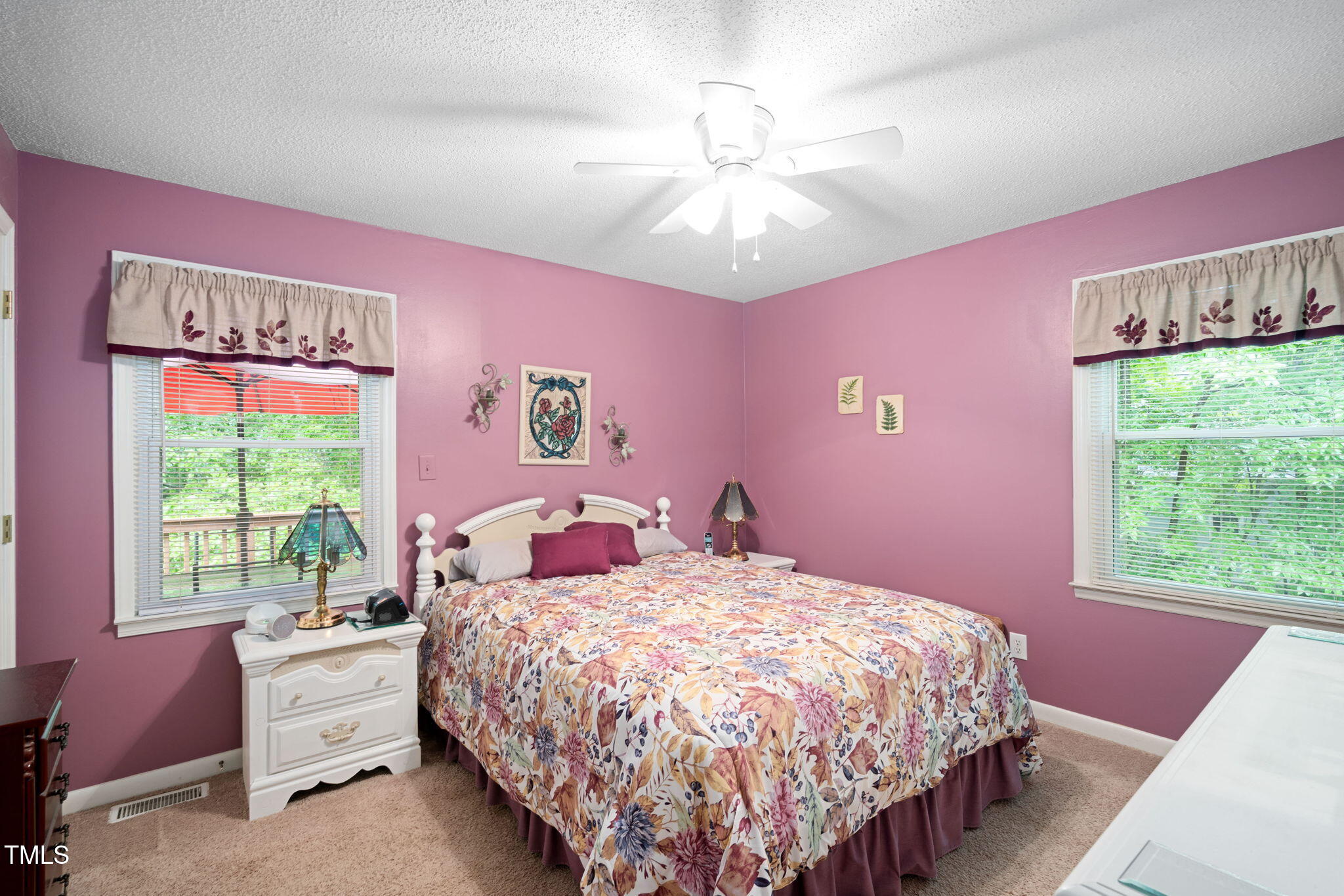 8236 Jackson Road Wake Forest, NC 27587 - Photo 27 of 74 a bed room with a bed and a chandelier