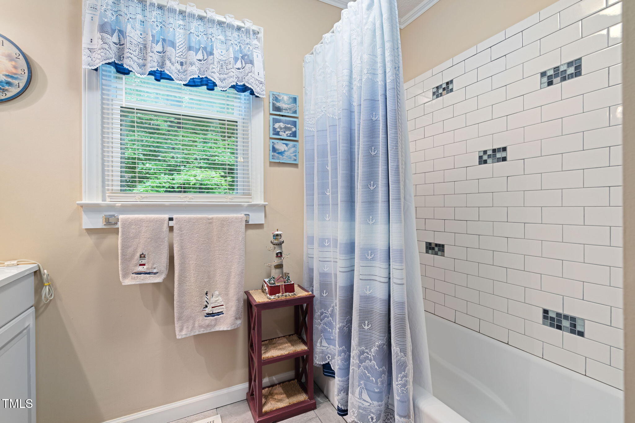 8236 Jackson Road Wake Forest, NC 27587 - Photo 29 of 74 a bathroom with a bathtub and a window