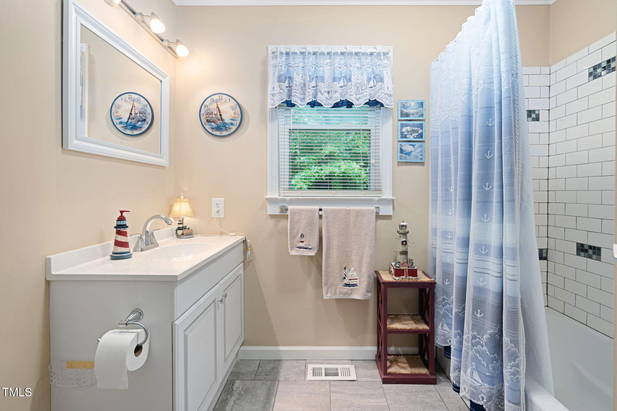 8236 Jackson Road Wake Forest, NC 27587 - Photo 30 of 74 a bathroom with a sink and a mirror