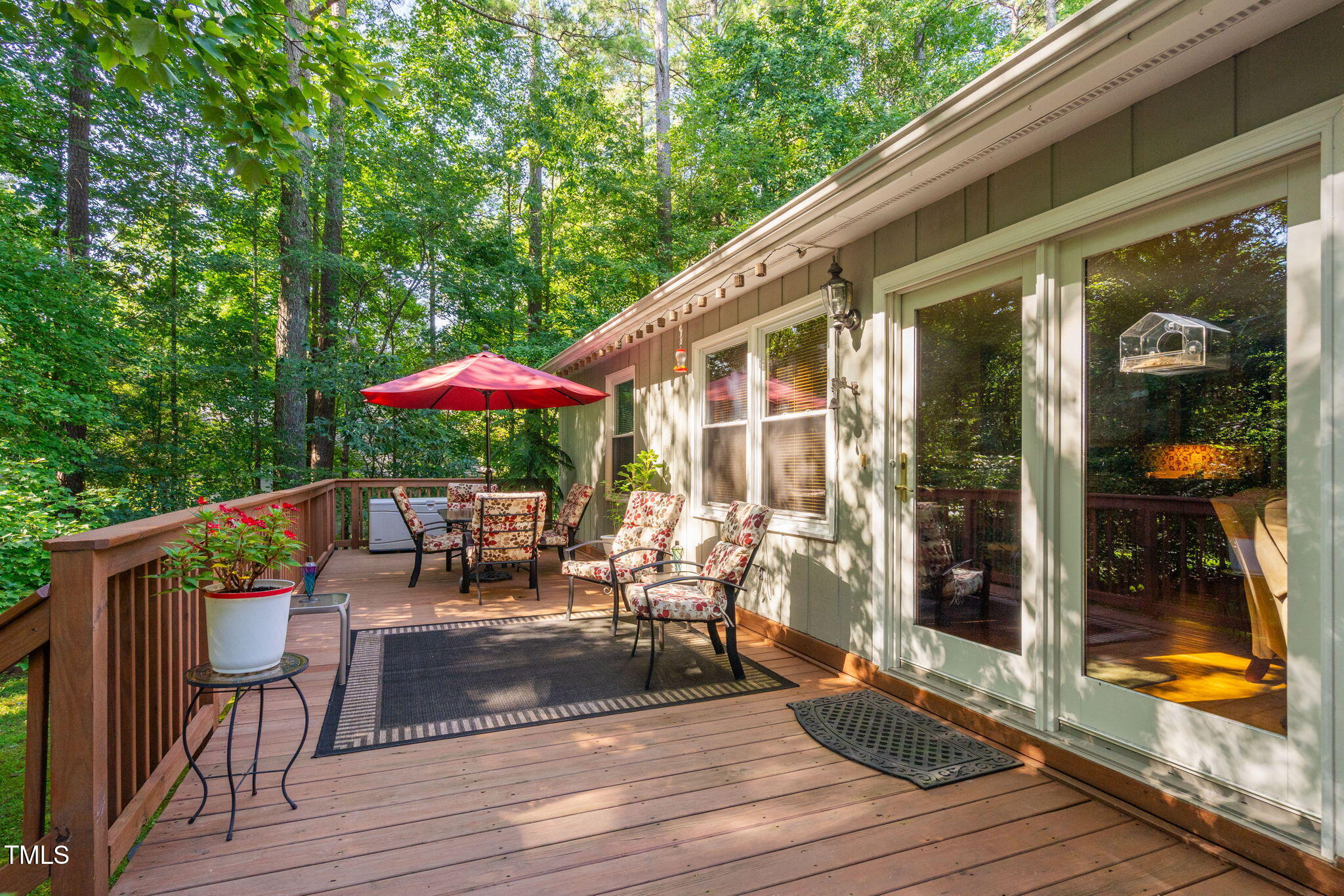 8236 Jackson Road Wake Forest, NC 27587 - Photo 35 of 74 a view of a patio with table and chairs with wooden floor and fence